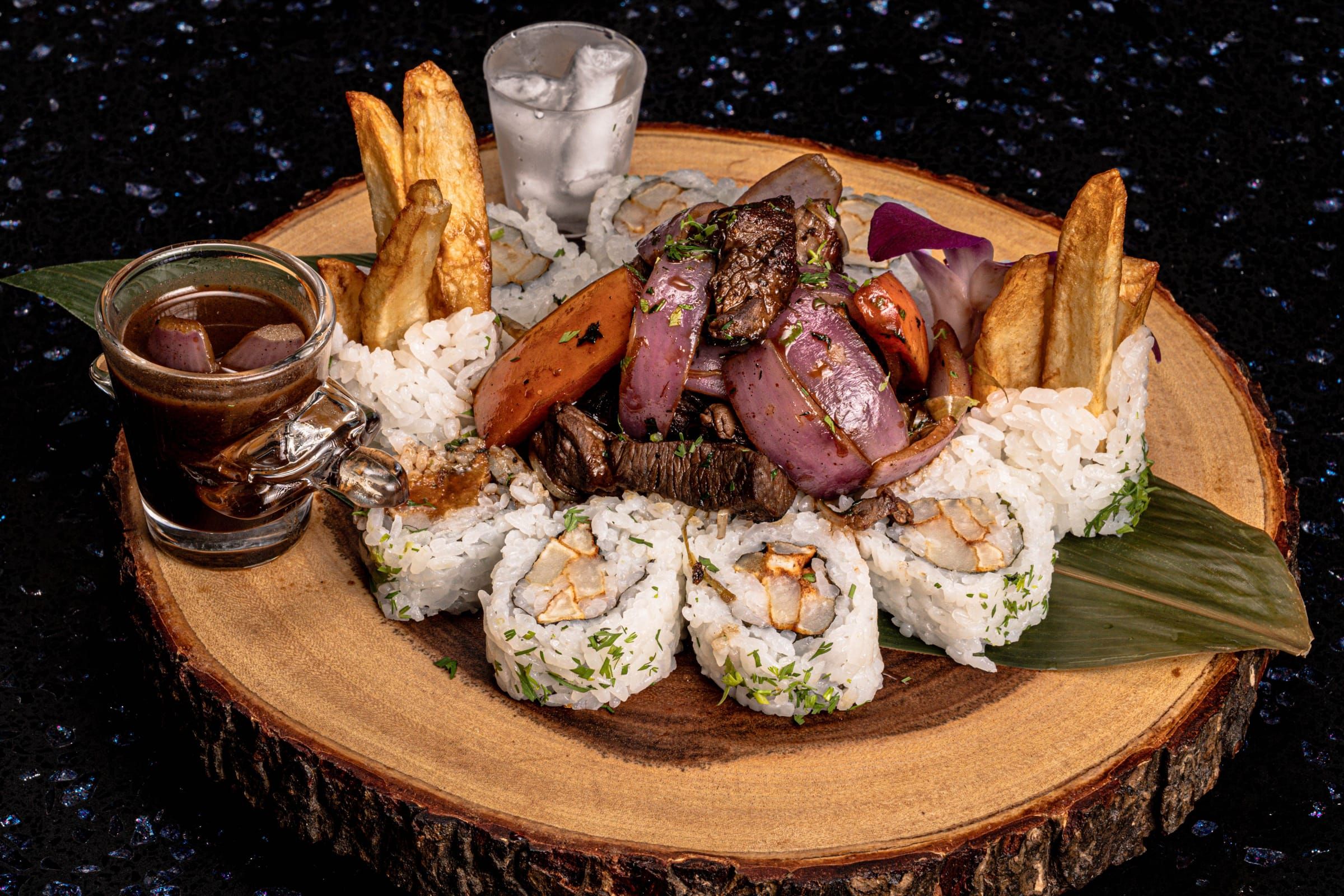Lomito Nikkei rolls on a wood board