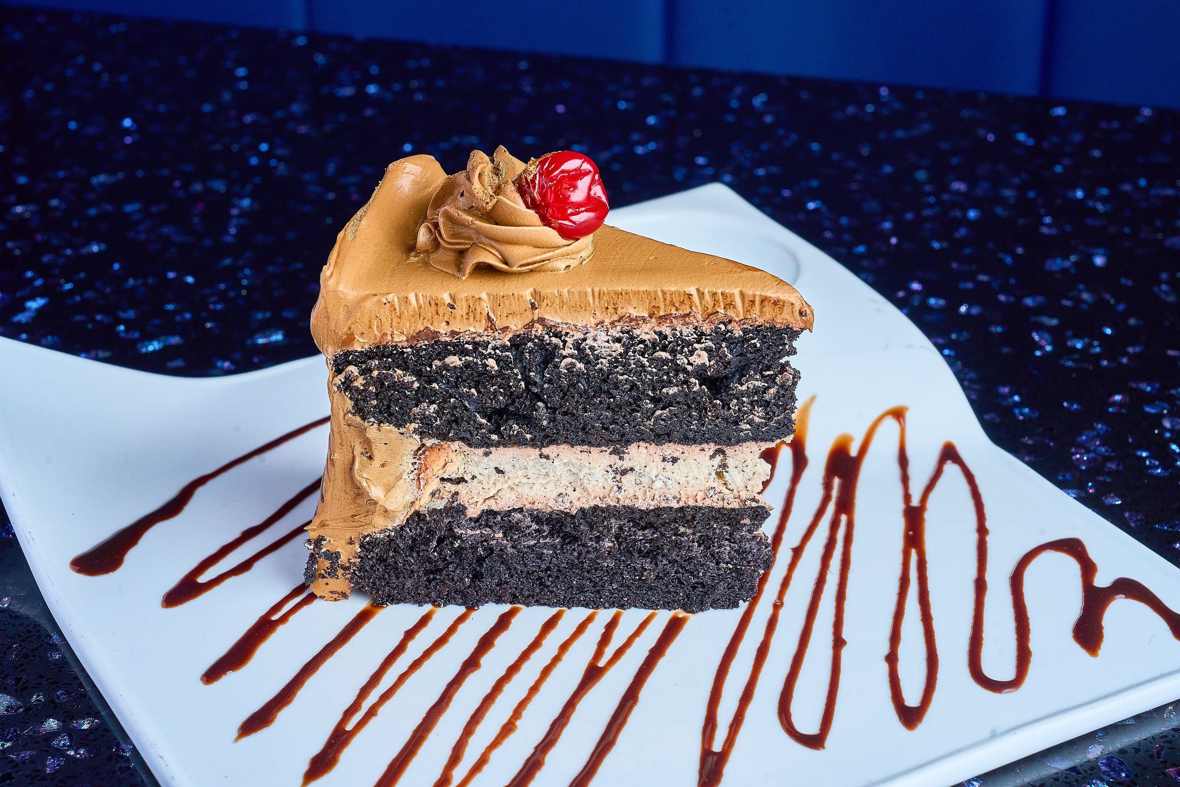 A slice of layered chocolate cake